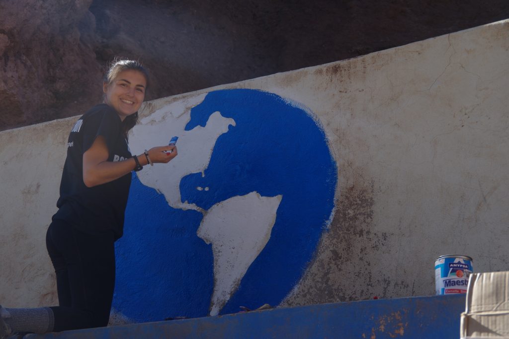 Sami paiting her mural