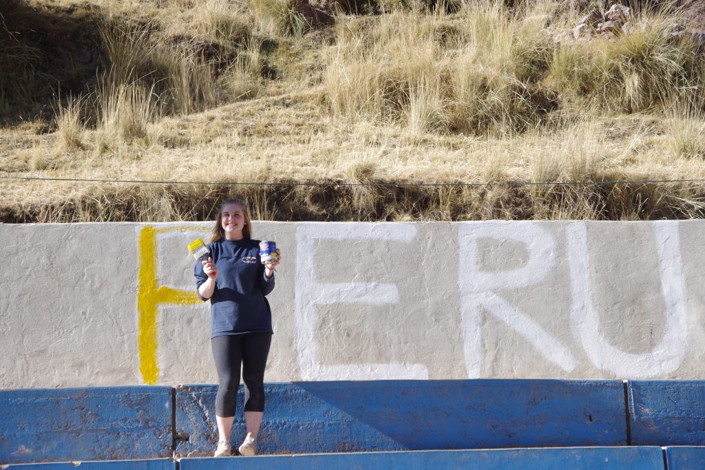 Kelly painting her mural