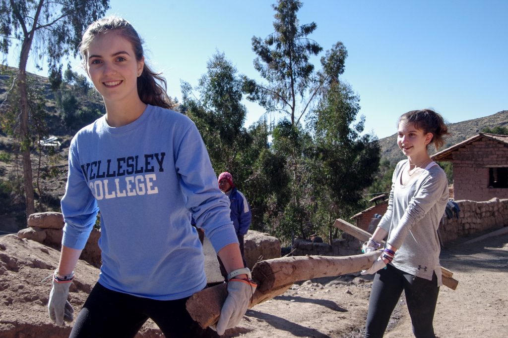 Chelsea and Sofia help clear the working area